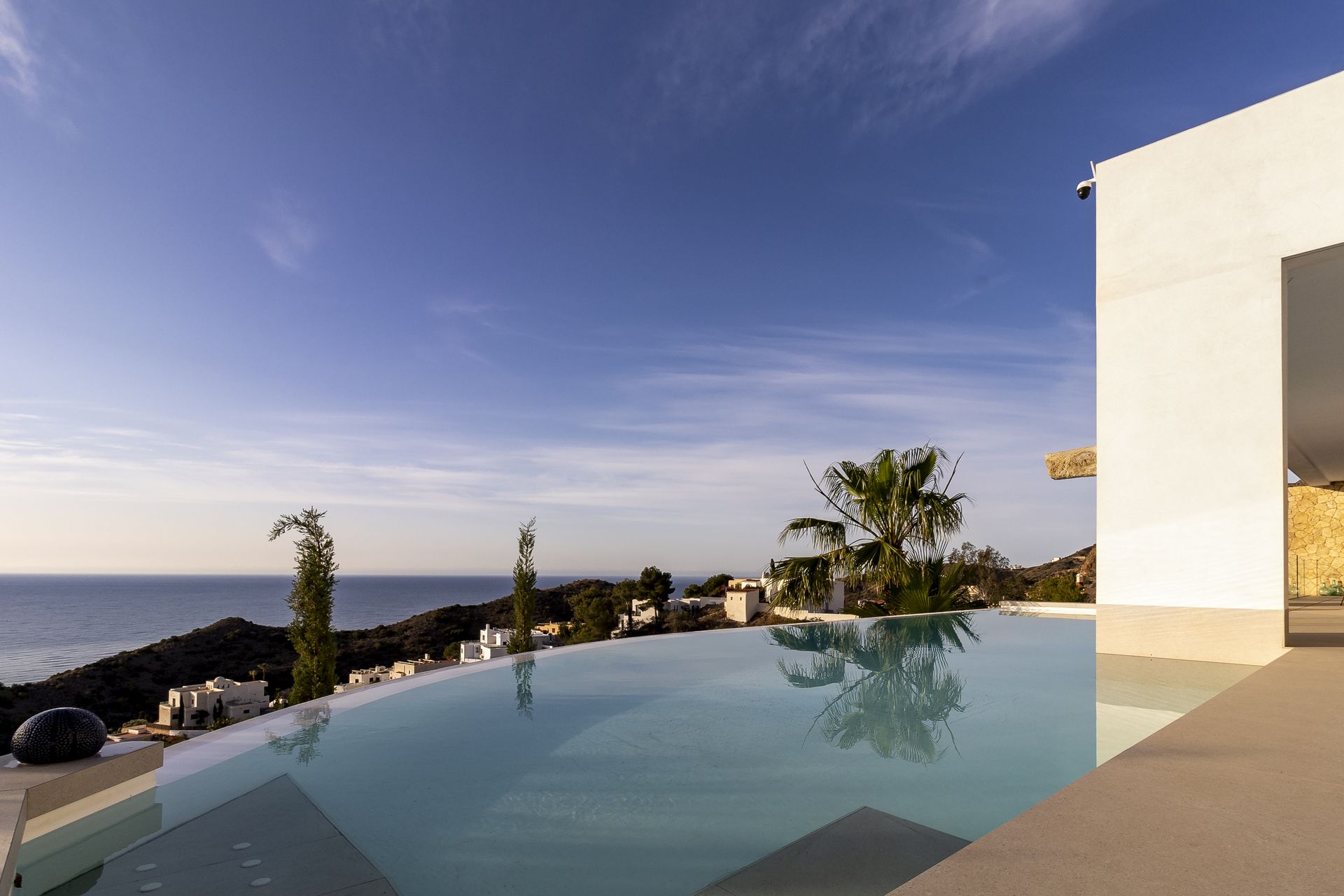 Villa with infinity pool at dusk