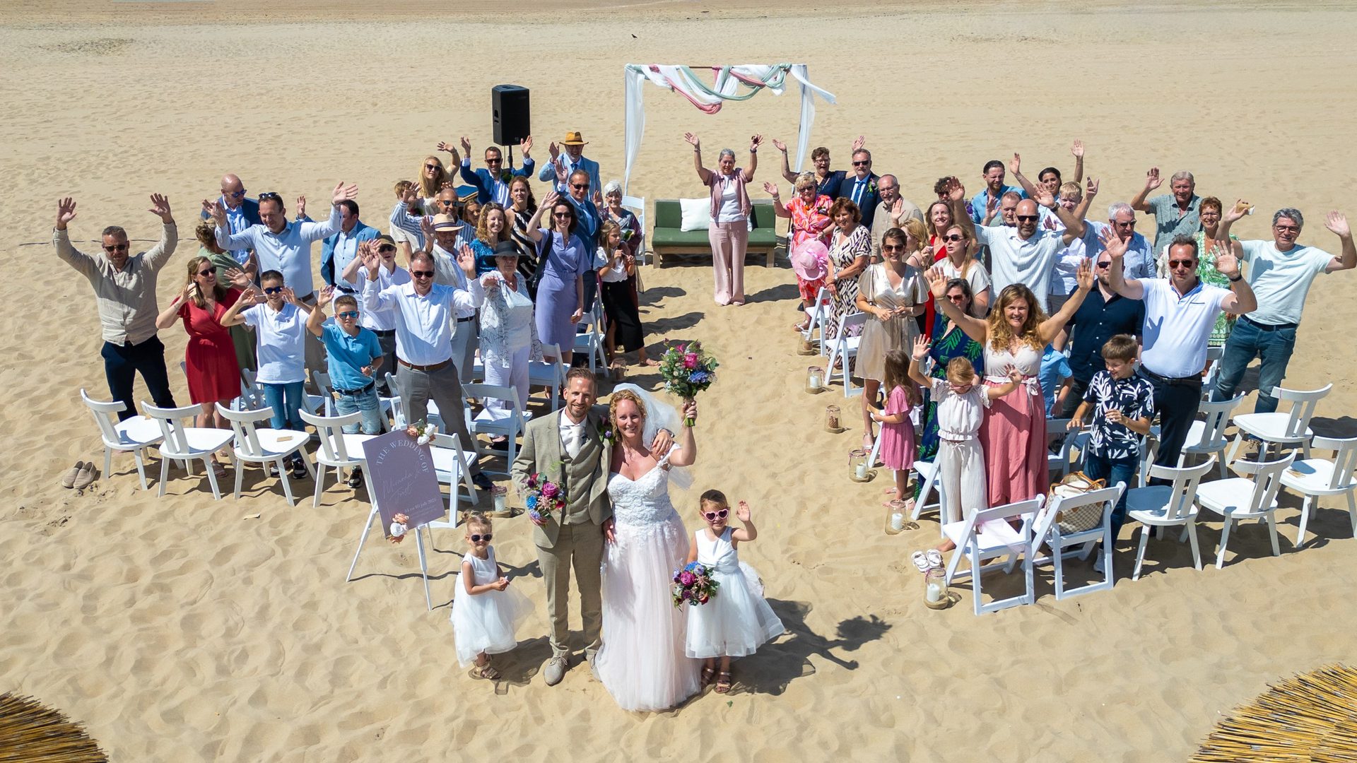 Beach wedding ceremony from above